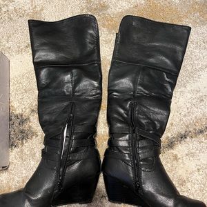 Knee high boots with wedge. Good condition no tears or rips